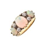 Opal and diamond ring, stamped '18ct', the three graduated oval cabochons with pairs of old