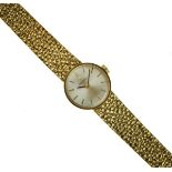 Omega - Lady's 9ct gold mechanical bracelet watch, the circular white dial with black gilt hands and