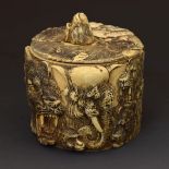 Japanese carved and stained ivory box and cover decorated in relief with lions, monkeys and