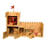 Wooden toy fort or castle with fittings including ladders, furniture etc, 73cm wide x 46.5cm high