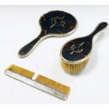 George V silver and tortoiseshell three piece brush set comprising: hand mirror, brush and comb,