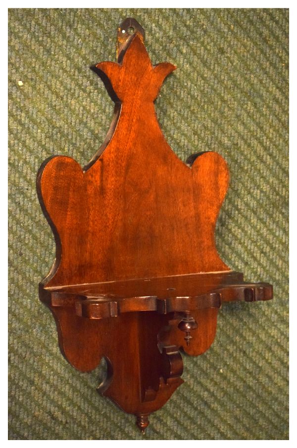 Late 19th/early 20th Century mahogany wall bracket of shaped design, possibly for a clock, 49cm high