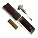 WITHDRAWN FROM SALE - Cartier gold-plated cigarette lighter, numbered 96140J, together with an Air