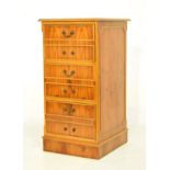 Reproduction yew-wood filing cabinet with gilt-tooled green skiver over six false drawer fronts