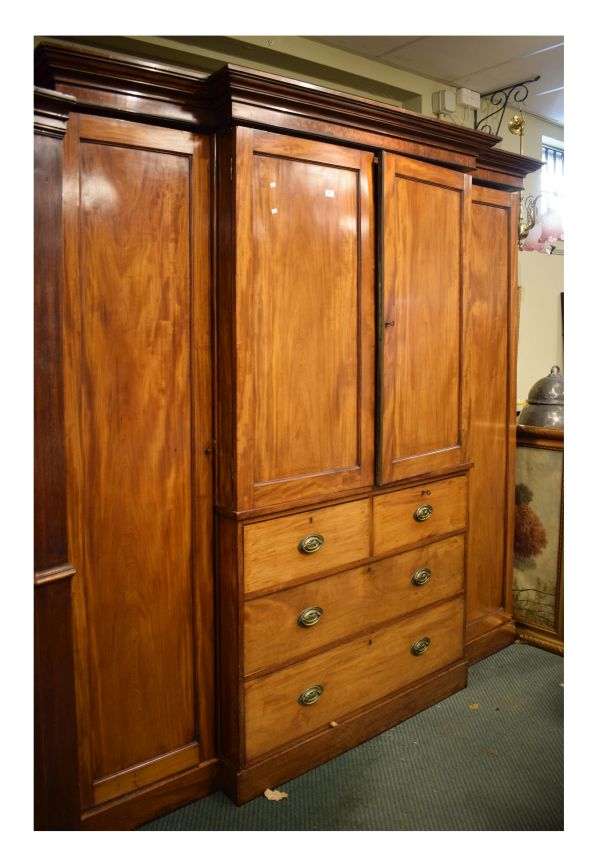 Mid 19th Century mahogany breakfront combination wardrobe and linen press, the moulded cornice