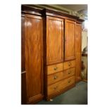 Mid 19th Century mahogany breakfront combination wardrobe and linen press, the moulded cornice