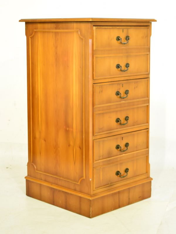 Reproduction yew-wood filing cabinet with gilt-tooled green skiver over six false drawer fronts