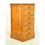 Reproduction yew-wood filing cabinet with gilt-tooled green skiver over six false drawer fronts