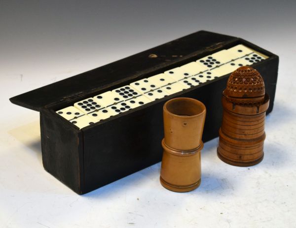 Two treen dice shakers/tumblers, the first modelled as a castle or rook, together with a coquilla
