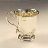 George V silver christening mug having a loop handle and standing on a circular foot, engraved