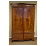 Early 20th Century mahogany double wardrobe fitted two panelled doors above two deep drawers,