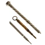 Three assorted propelling pencils, the largest with spiral decoration and carnelian terminal (3)