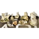 Group of eight reconstituted stoneware garden ornaments modelled as cats in various poses Condition: