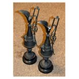 Pair of late 19th Century spelter ewers or jug vases, each on turned ebonised socle (2) Condition: