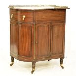 19th Century mahogany corner pedestal cupboard, the bow-breakfront top with pierced three quarter