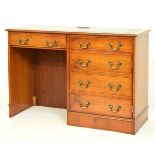 Reproduction yew-wood kneehole desk with gilt-tooled green skiver over five drawers and kneehole