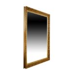 Modern gilt framed overmantel mirror having a bevelled rectangular plate within leaf moulded