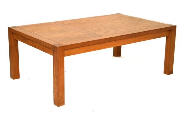 Modern teak coffee table of panelled rectangular design on square section supports Condition: