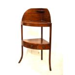 George III mahogany bowfront corner washstand having a shaped splashback with shelf over two