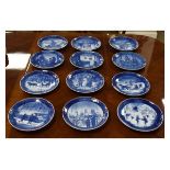 Twelve Royal Copenhagen Christmas plates 1978-1989, each with blue and white festive decoration