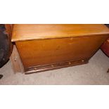 An antique pine blanket chest with candl