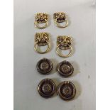 A set of 4 circular brass rosette drawer