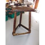 An antique country made 3-legged stool w