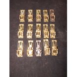 A set of 15 reproduction brass cabinet m