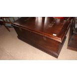 An antique stained blanket box with stra