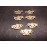 Seven antique brass drawer pulls with dr