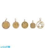 Group of five 18kt gold pendants peso 47 gr.