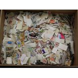 WORLD STAMPS (7kg) off paper - mixture in a carton.