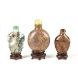 Three Chinese Agate Snuff Bottles. Three Chinese Agate Snuff Bottles . Max. Ht. 3". A Private