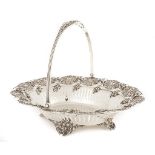 Sterling Silver Footed Cake Basket. Reticulated and molded relief with cherubs and grapevine