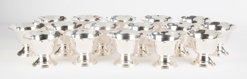 Sixteen Sterling Silver Dessert Bowls. 86.4 ozt . Ht. 4" Dia. 5". Online bidding available: