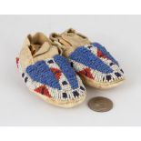 Pair of Sioux Baby's Moccasins. Pair of Sioux Baby's Moccasins . L 4 1/2" W 2" Ht. 1 1/2". Online