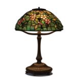 Tiffany Studios New York Apple Blossom Leaded Glass and Bronze Table Lamp. The shade, with rare,