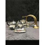 A quantity of silver plated items including a tea set and a brass horn.