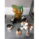 A Majolica monkey tankard with other china animals.