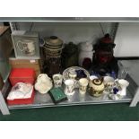 A shelf full of china and glass including four Rumtopfs.