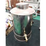 A large metal tea/drink dispenser.