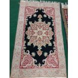 Three rugs in various colours and patterns