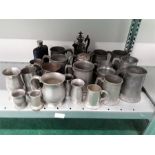 A large collection of Pewter measures and tankards.