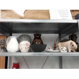 A quantity of china vases to include a Poole Pottery vase, plate, resin pig etc.