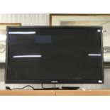 A Samsung flat screen UHD TV. MU6400 class with 55” screen.
