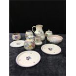 Twelve pieces of Poole pottery in the traditional pattern.