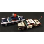 Masudaya (Japan) Police Car with Crank Siren, length 28cm. Together with an Ichiko Bump 'n' Go