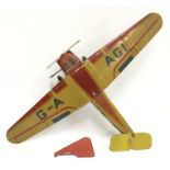 Mettoy (UK) Aircraft: tinplate model in red and yellow livery, call sign 'G-A AGI', clockwork