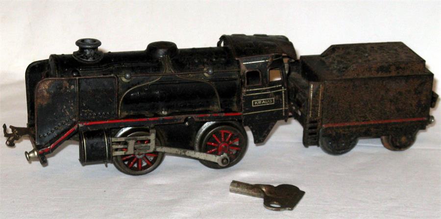 A BUB KRAUS FANDOR 0 Gauge Black lined Red 0-4-0 and Tender - the Locomotive has an Excellent C/W
