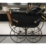 Early 20th century doll's pram with spoked metal wheels, canopy, removable panels to reveal